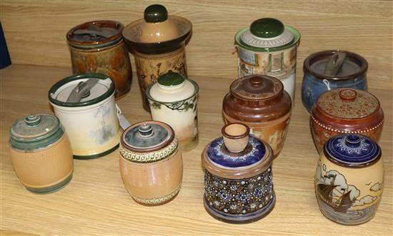 Twelve Doulton tobacco jars and covers, various designs